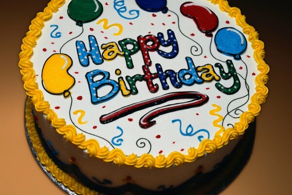 Bright cake with an inscription in English