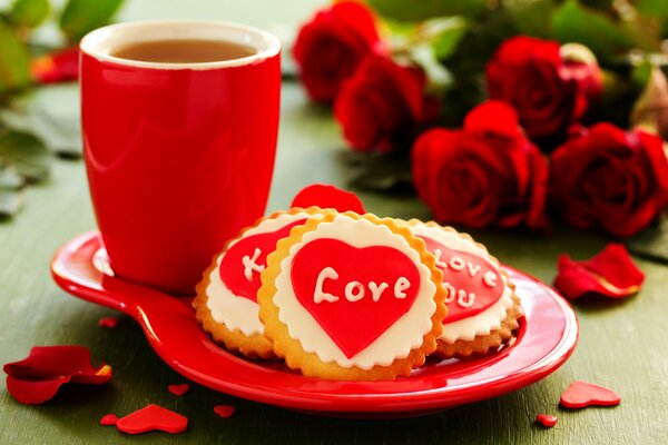 Biscuits et une tasse de thé. Bouquet de roses