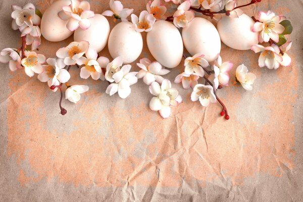 Easter eggs on a branch with flowers