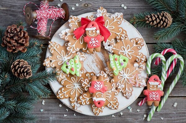 Cookies for Christmas in the shape of snowflakes on a plate