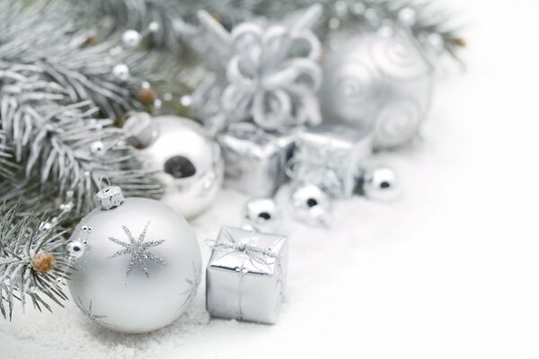 Silvery Christmas toys and a fir tree