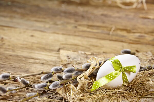 An egg decorated with a ribbon for a holiday