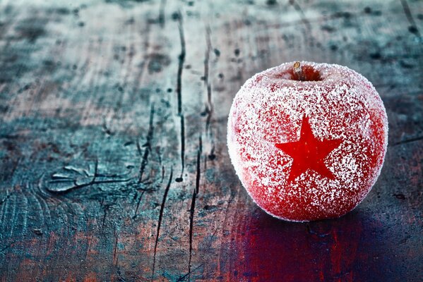 Red apple, covered with frost