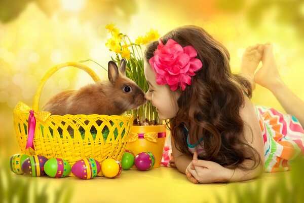 Cute girl with curls and an Easter bunny