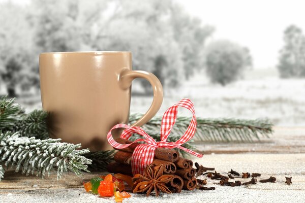 Warming mug on a snowy background