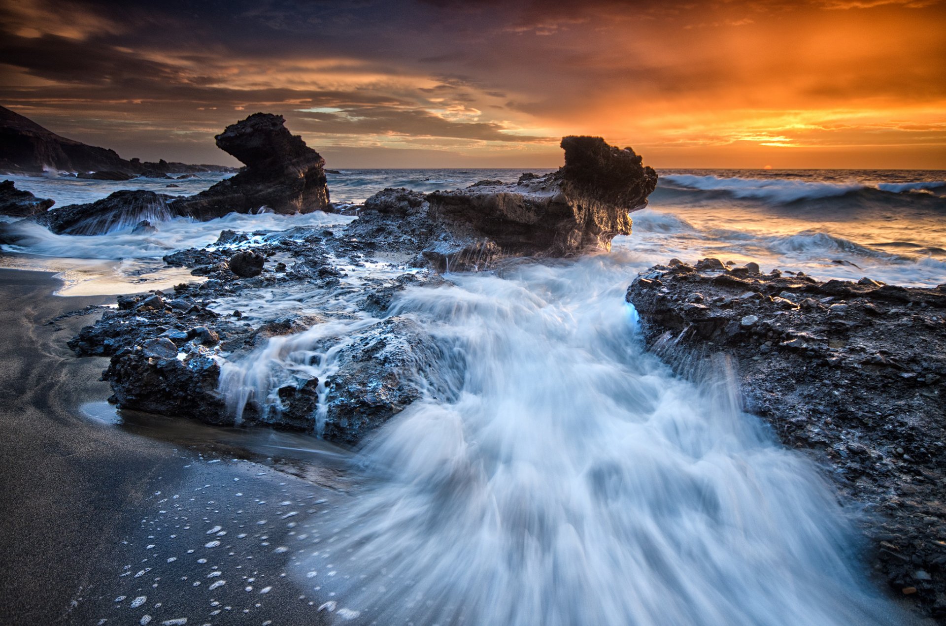 pain atlantic ocean canary islands beach rock sunset