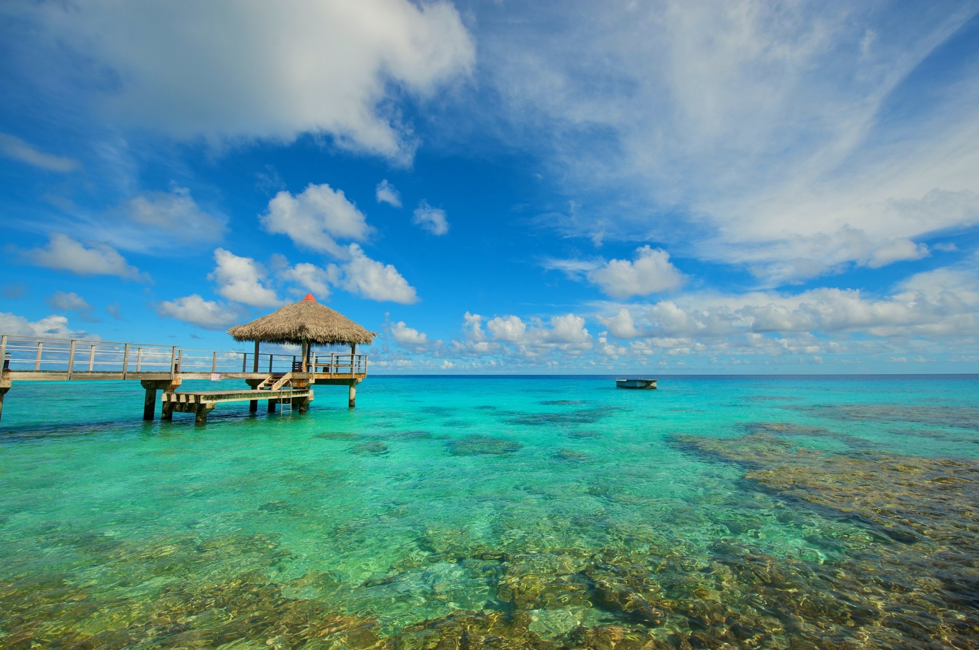 ozean wasser steine pier boot himmel wolken