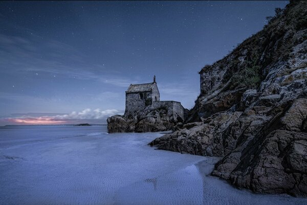 The sea ebb at night. Starry sky