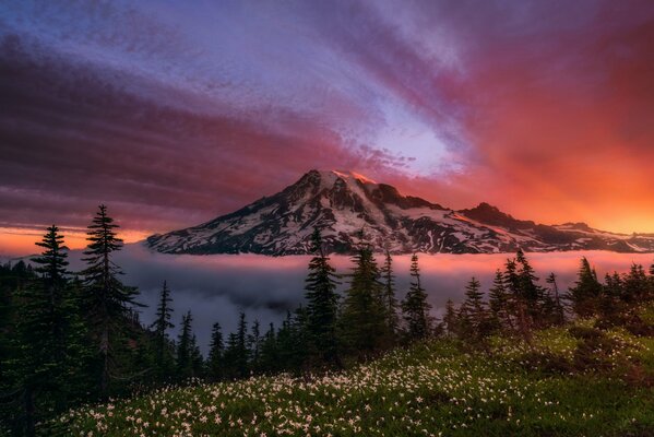 A mountain against a red sky