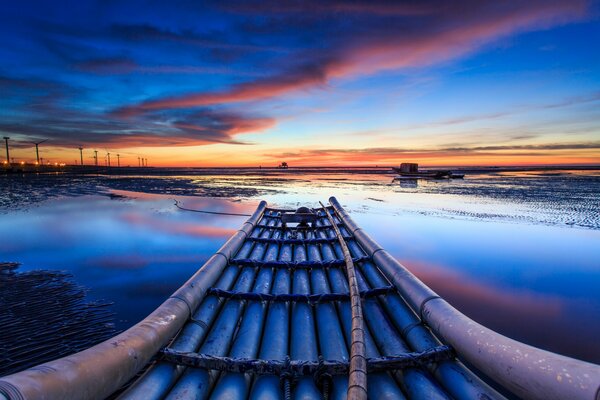 Windmills on the horizon. Clouds at sunset