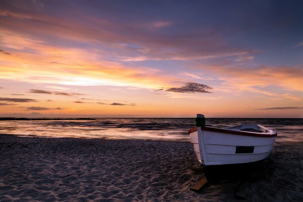 Landscape boat on sunset background