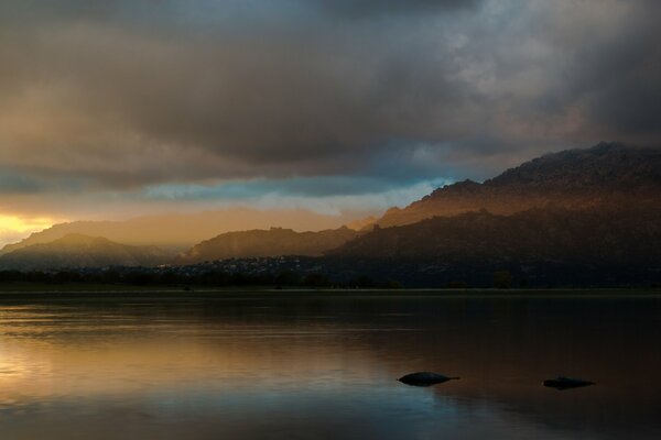 The fog spread over the night lake