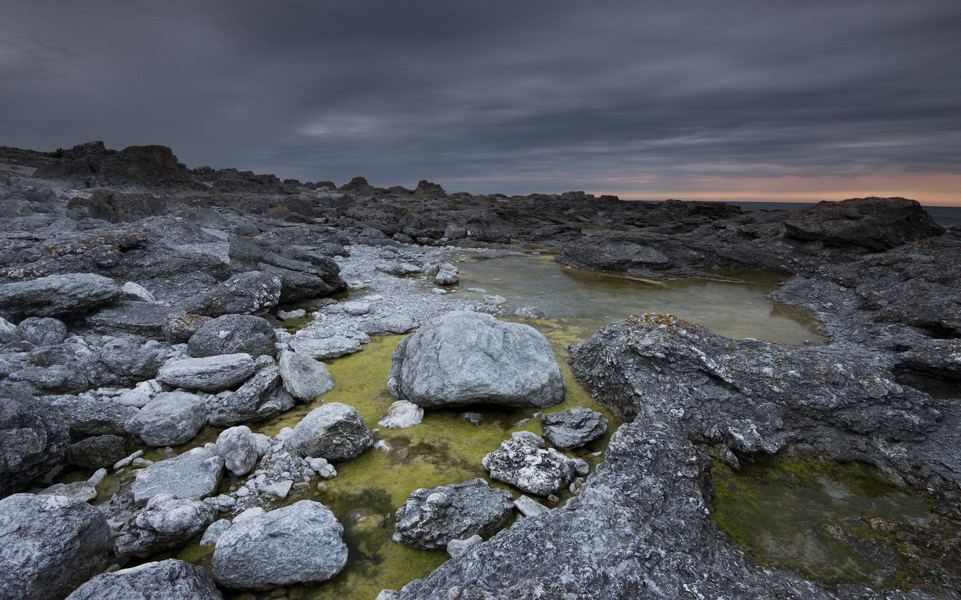 unset sea stones landscape