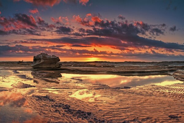 The sea at low tide in the evening sunset