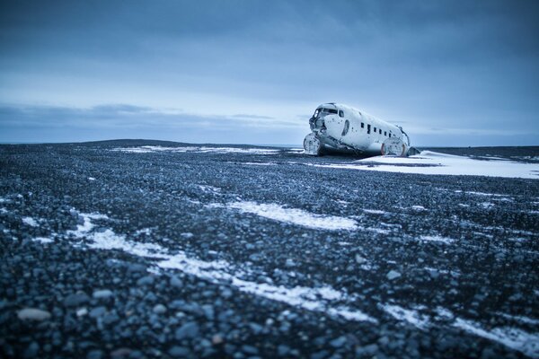 A lonely plane in the field, a lonely void above the clouds