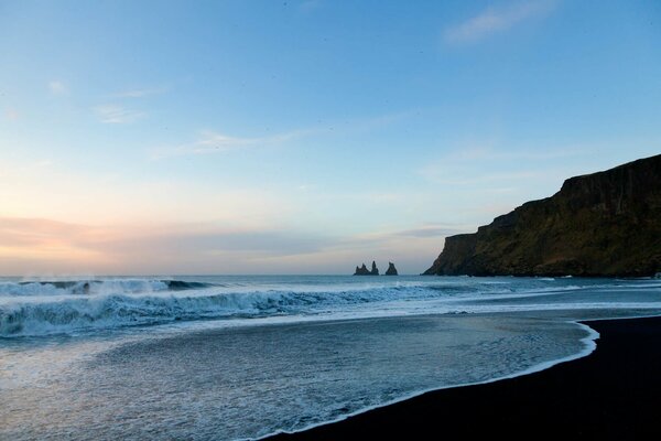 Sandy seashore with waves