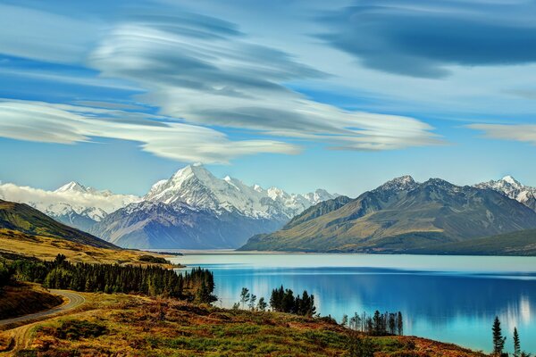 View of the blue lake and snowy peaks