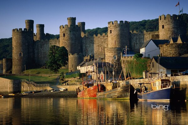 Castle with moored boats on the shore