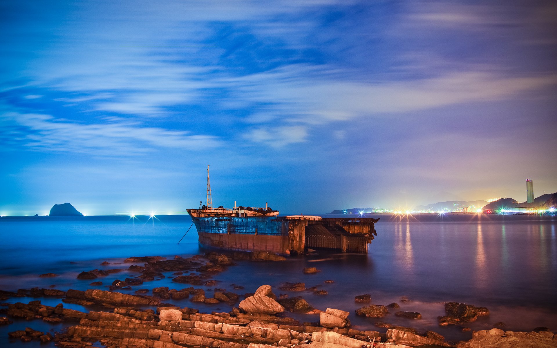 taiwan sky clouds stones beach lights town