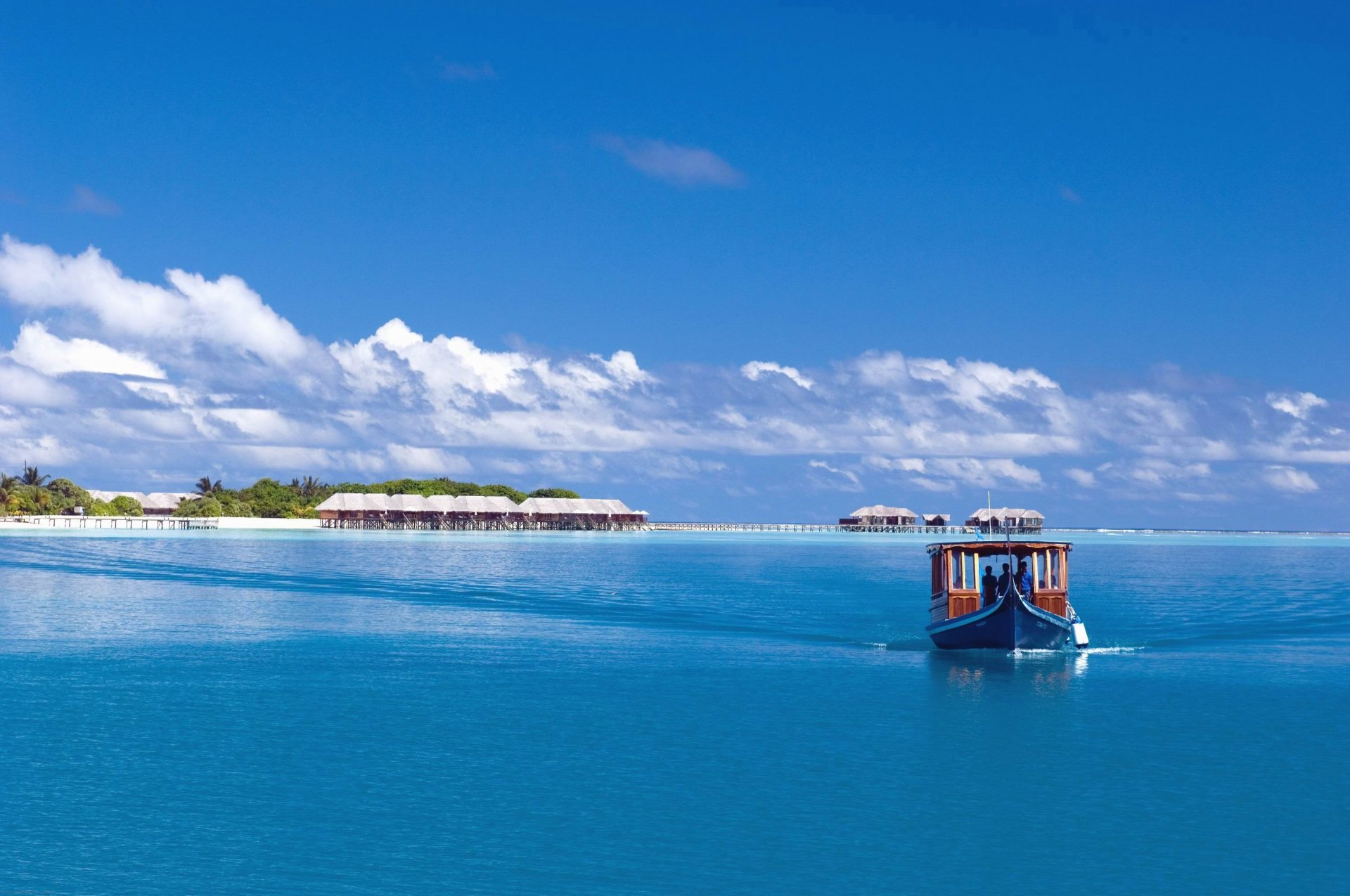 ky sea ocean island maldives boat boat palm trees clouds bungalow