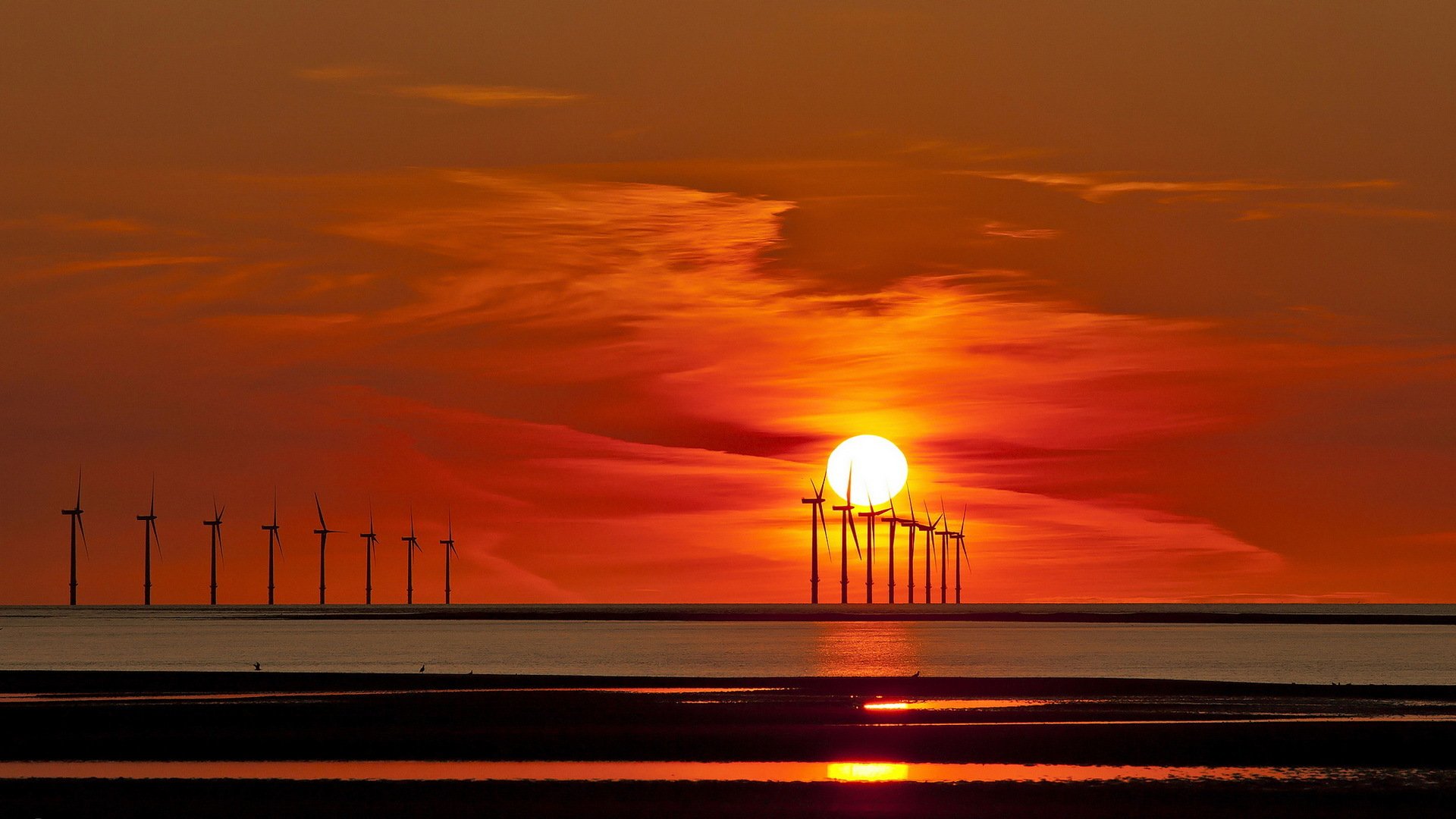 mer coucher de soleil moulins à vent paysage