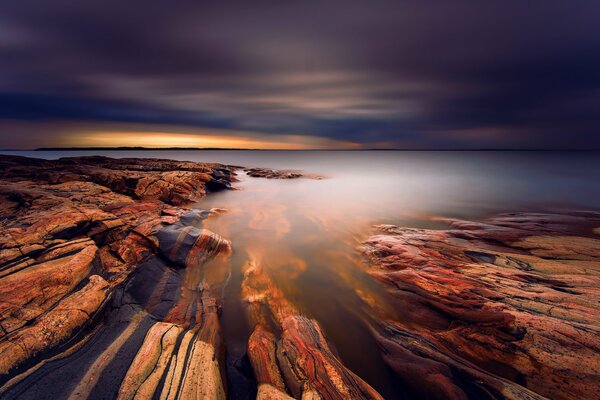 Striped stones under a layer of water