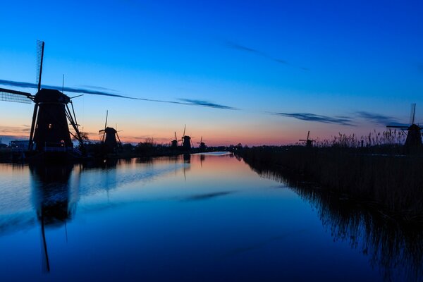 Evening river on the background of a colorful sunset