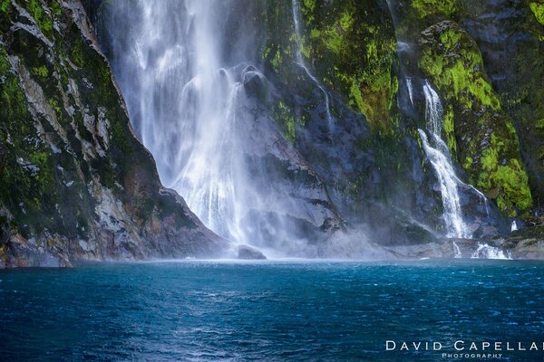 Mountain waterfall blue waters of the lake