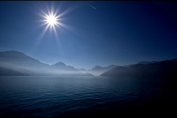 Shooting star over the water surface