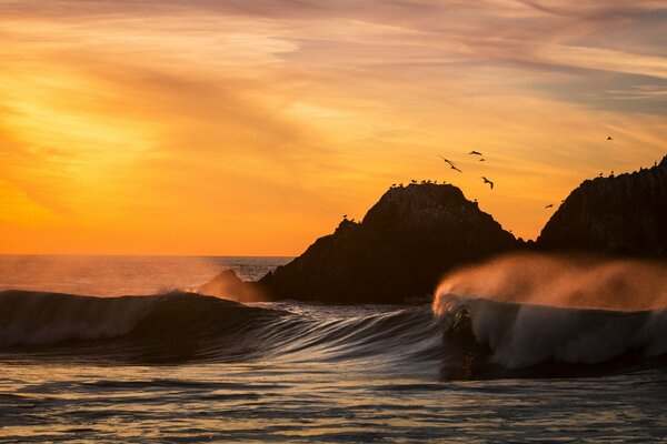 Sunset and waves in the ocean