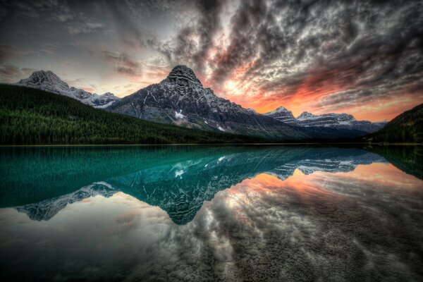 Reflection of sunset and mountains in the lake