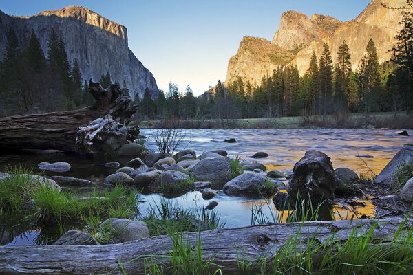 The river flows through the mountains