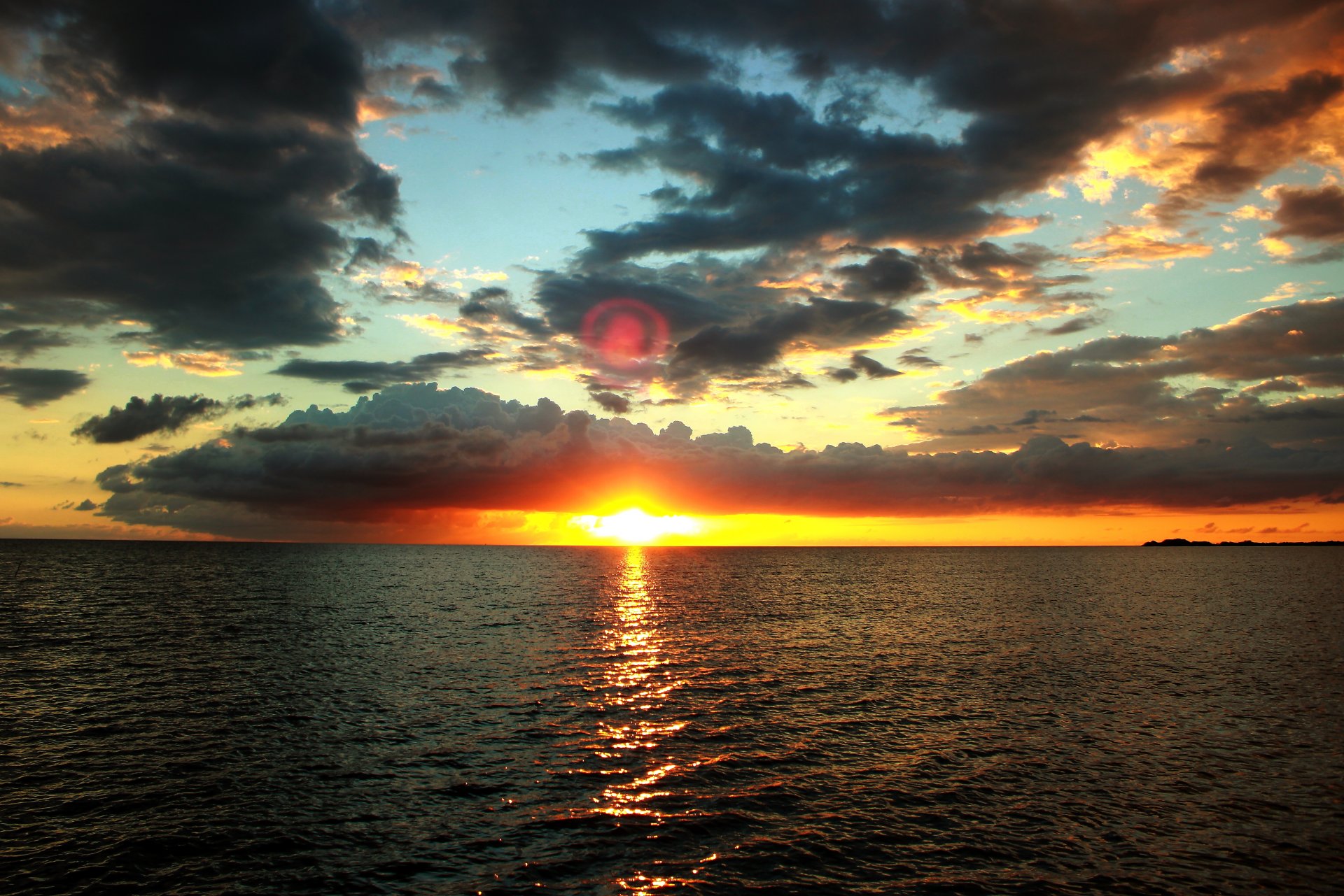 unset night sea sky horizon sun water cloud