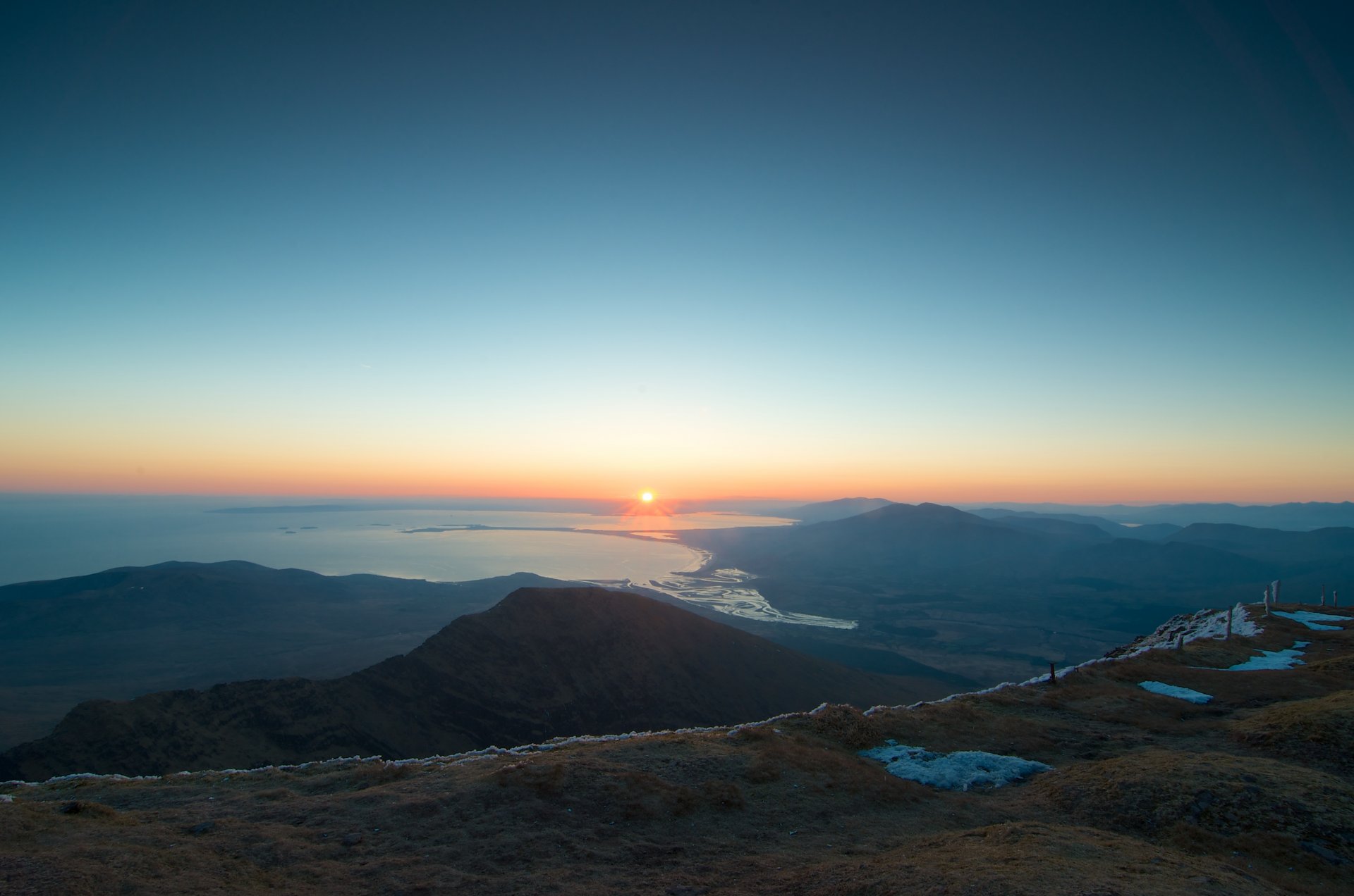 grass sky sun sunset horizon snow ocean water