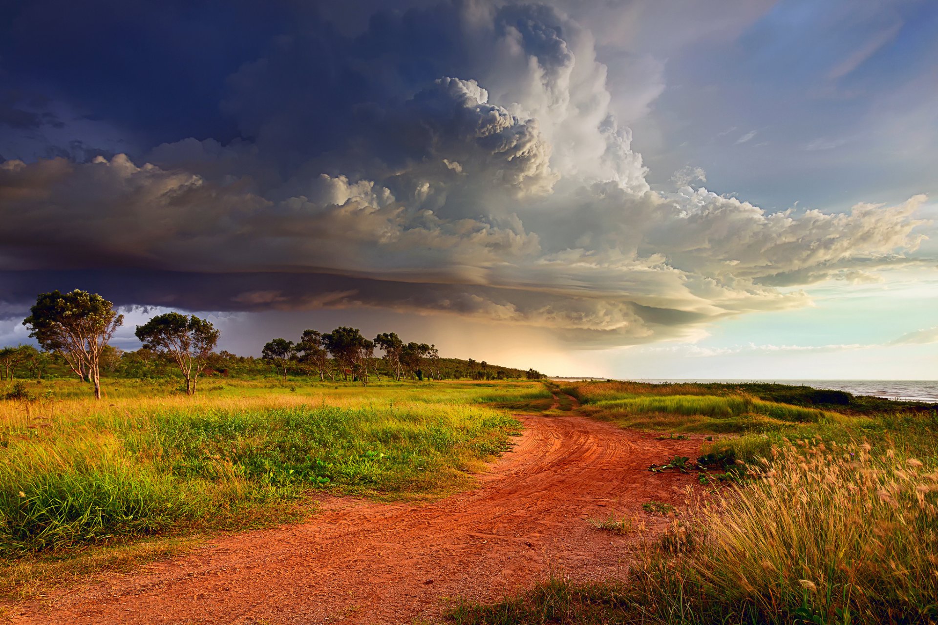 australia storm clouds sky clouds cyclone coast road