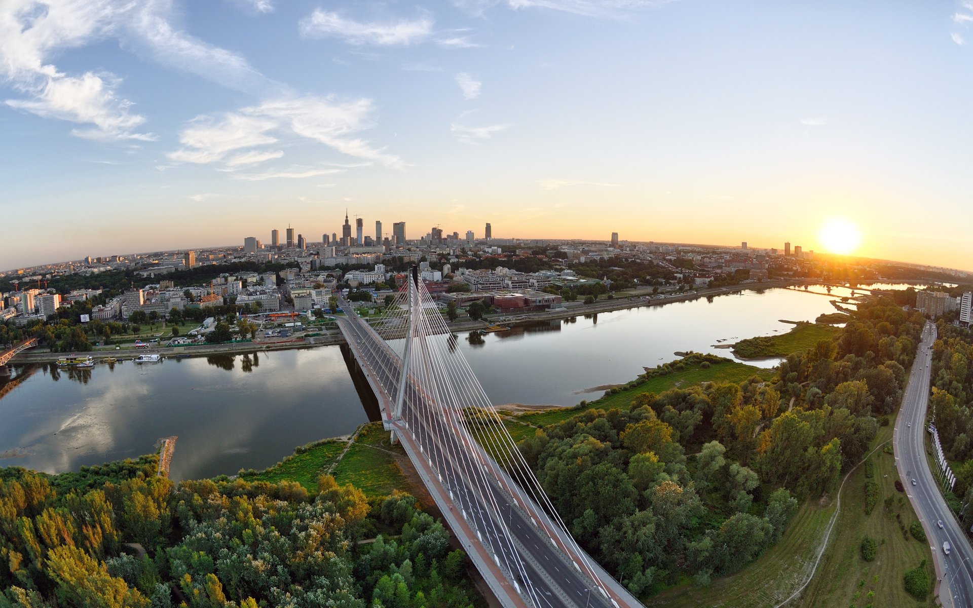 warsaw town bridge river hung road sky sunset house support horizon sun forest tree