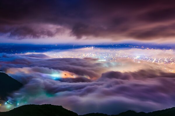 Taipei, shining with lights, is wrapped in clouds