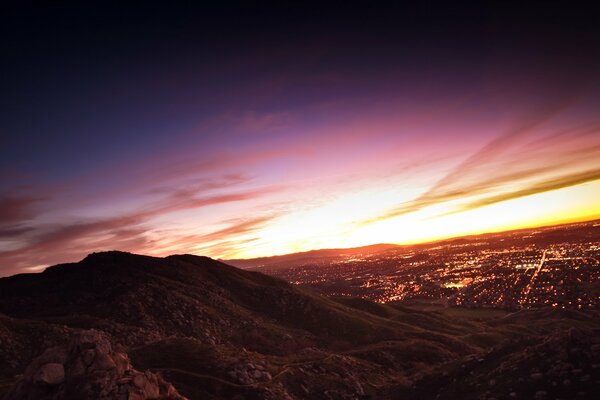 Sunset from the mountain with a view of the city