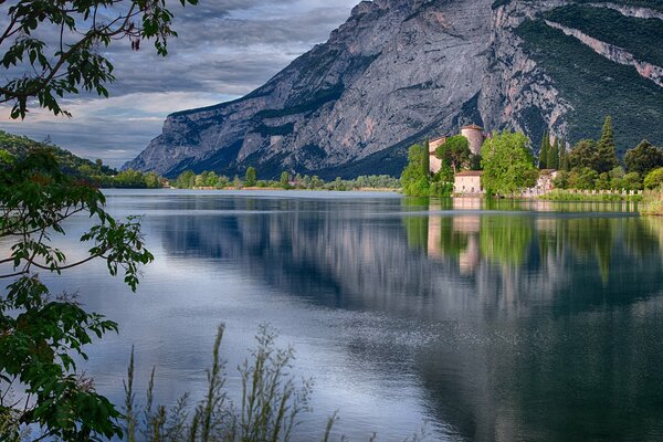 Toblino Castle among the lake water surface