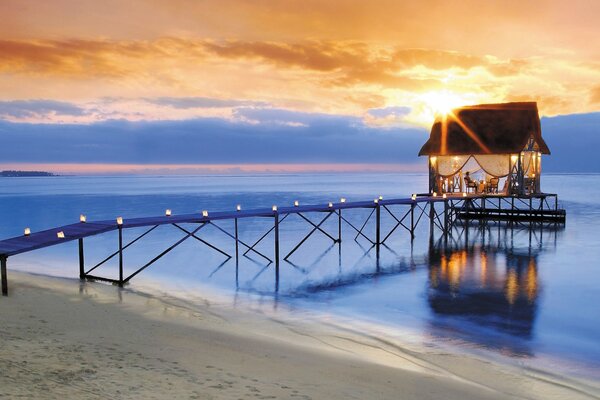 Pier in the light of the golden rays of the sun