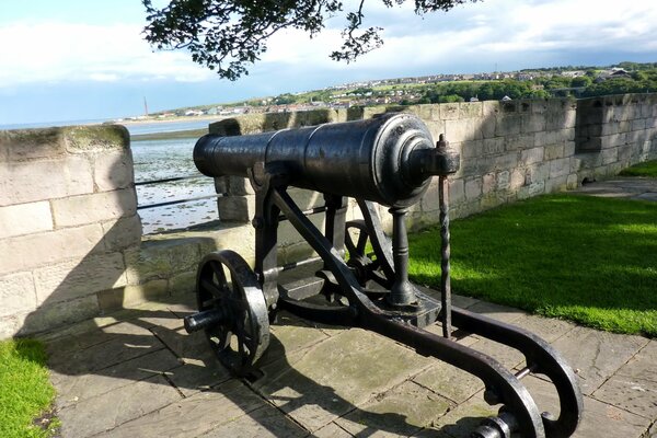 A cannon in a fort near the sea coast