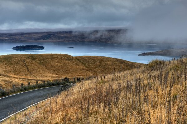 The road to the lake in the fog