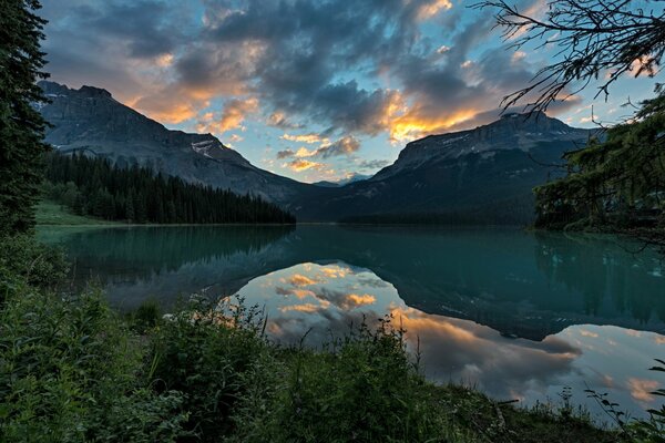 Park in canada mountains and forest are reflected in the lake