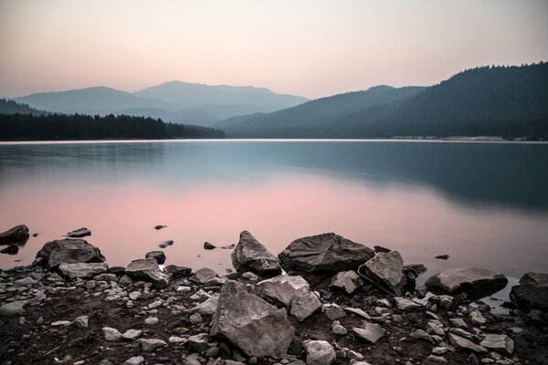 Quiet sunset by the lake in the mountains