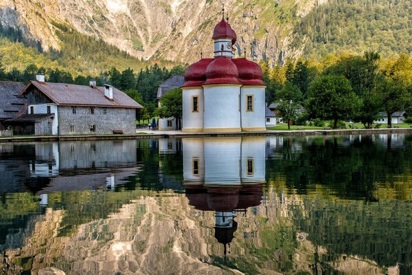 Church on the background of water and mountains