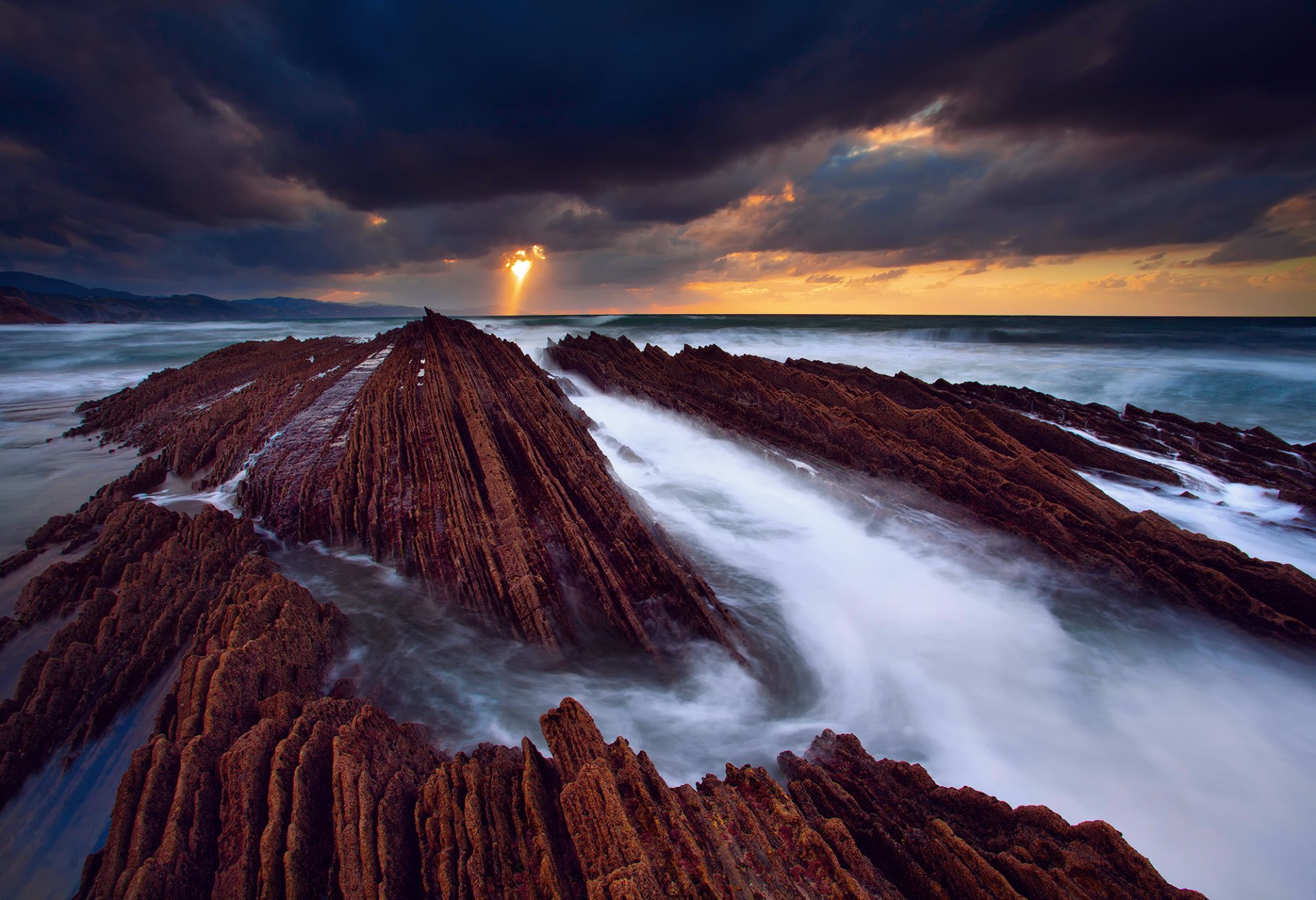 pain zumaia atlantic ocean rock sea water flows extract sky light cloud