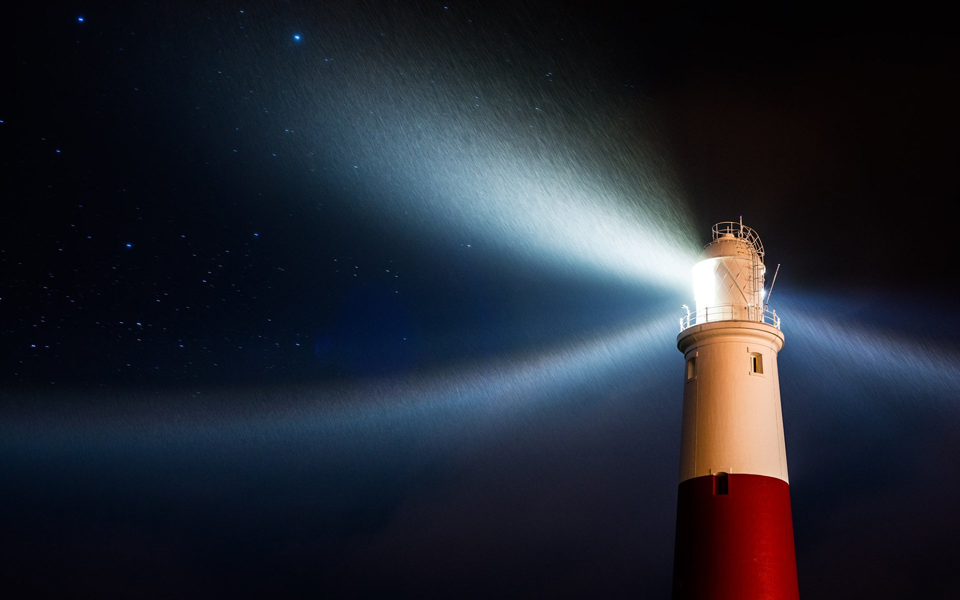 faro notte luce stelle pioggia