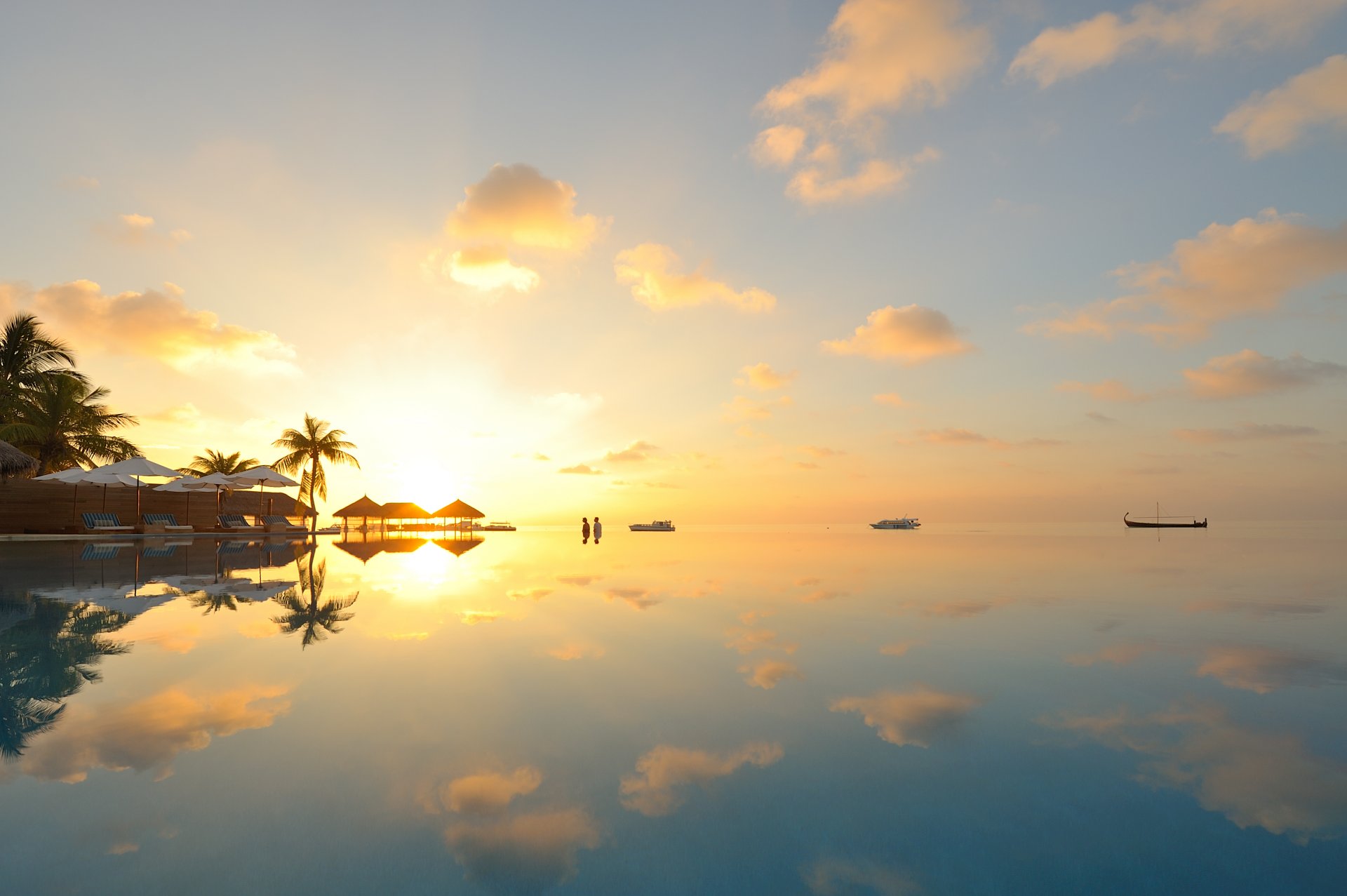 maldive tramonto nuvole barca orizzonte