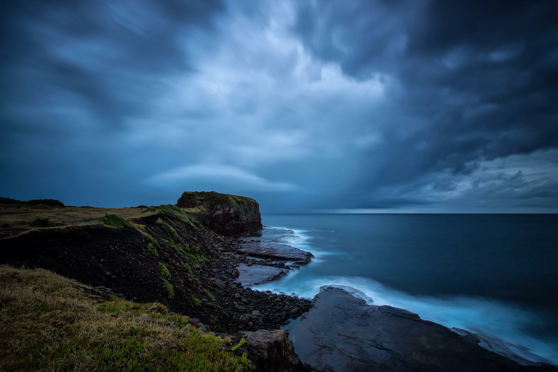 meer strand steine felsen wolken