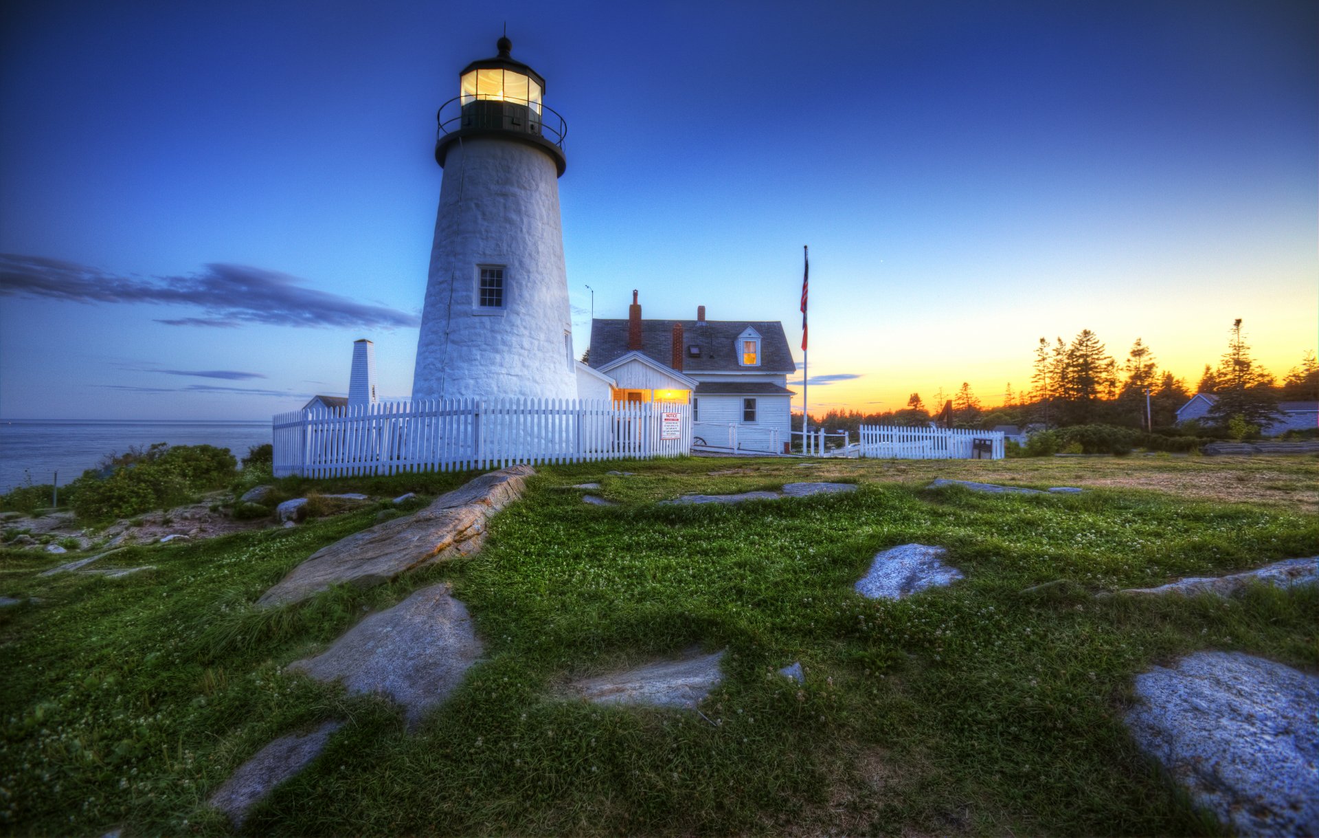 lighthouse sunset rock grass green light